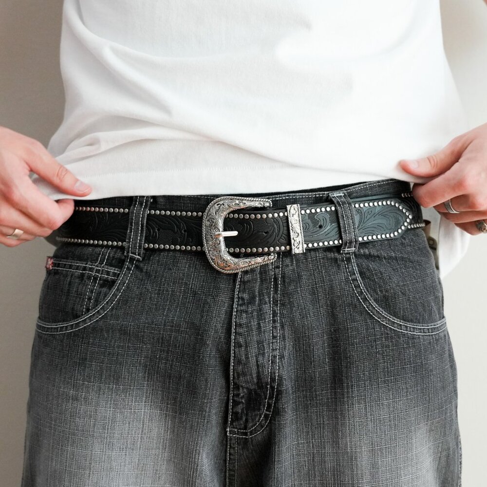 y2k silver buckle black tooled leather belt — western swirl wave style
